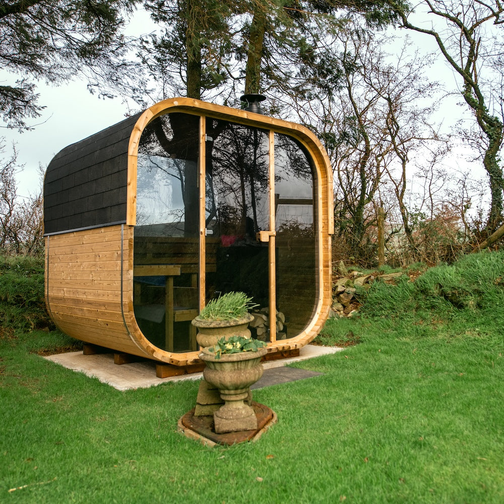 Cube 250 outdoor sauna in a garden