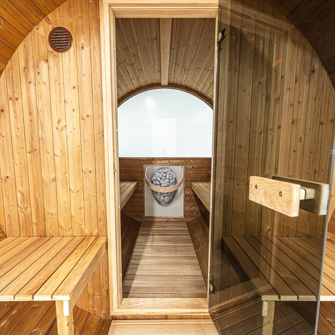 Barrel 250 outdoor sauna in a garden