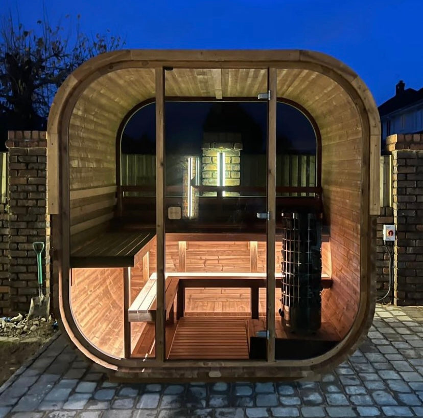 Cube 250 outdoor sauna in a garden