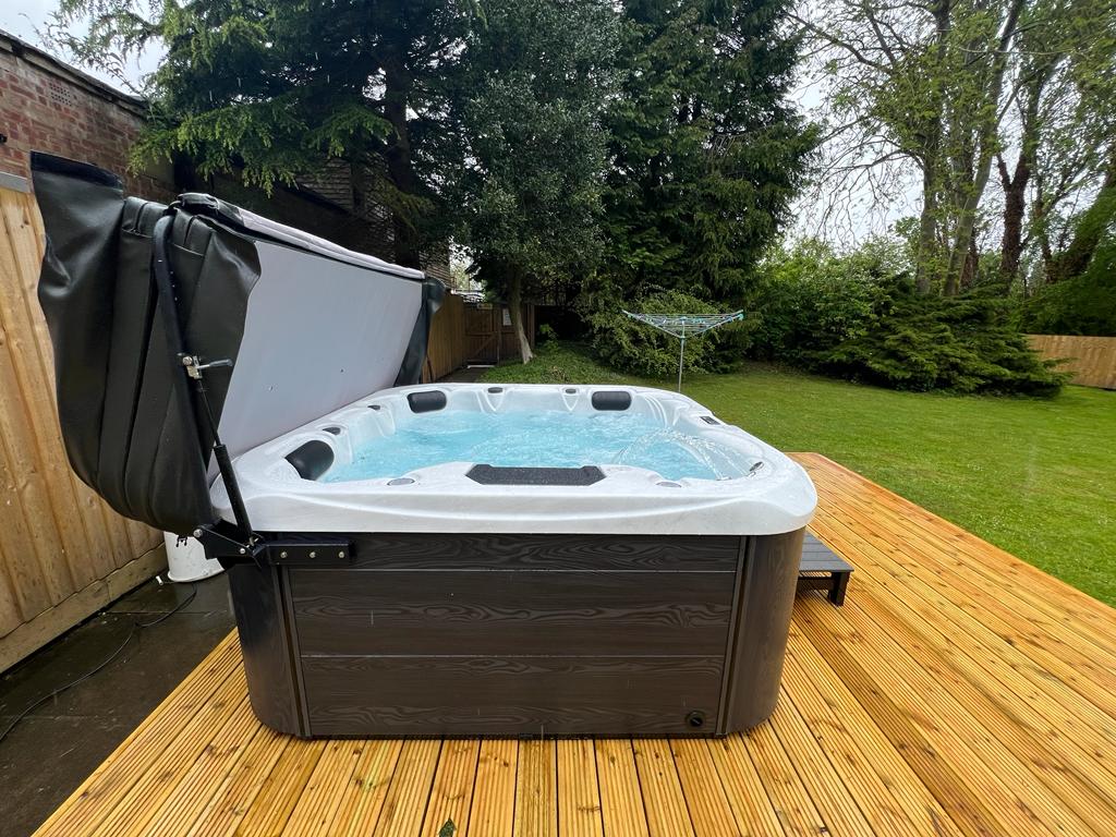 hot tub with lounger seat
