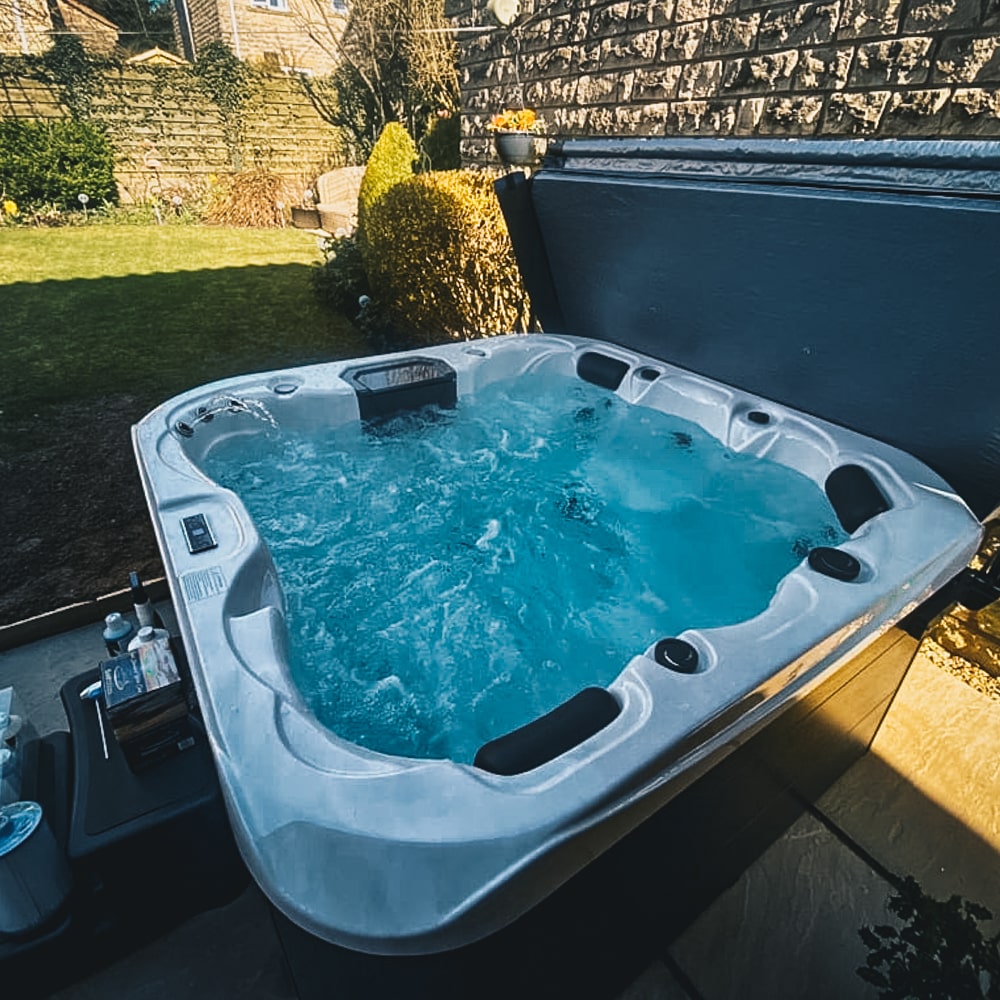 Retreat Plus plug and play hot tub in a garden