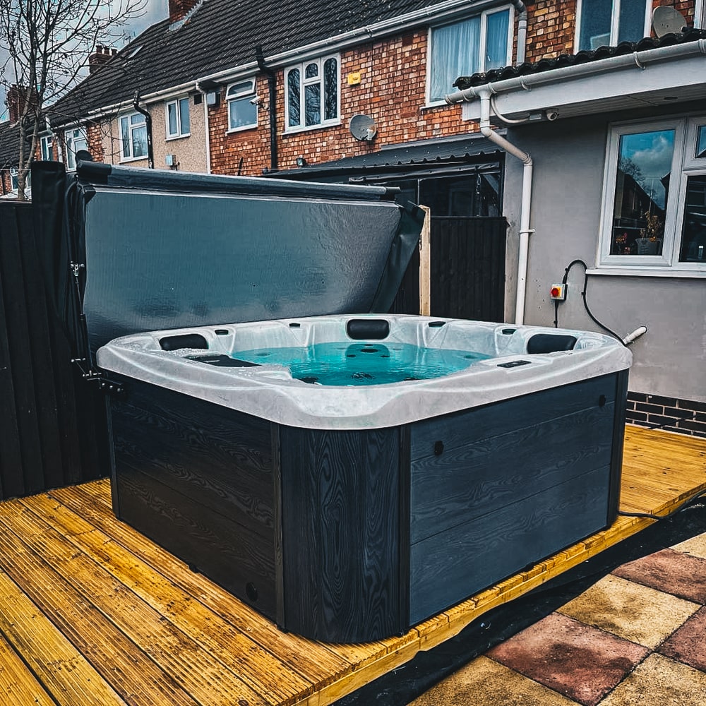 Retreat Plus plug and play hot tub in a garden