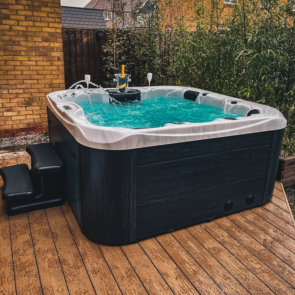 Retreat Plus plug and play hot tub in a garden