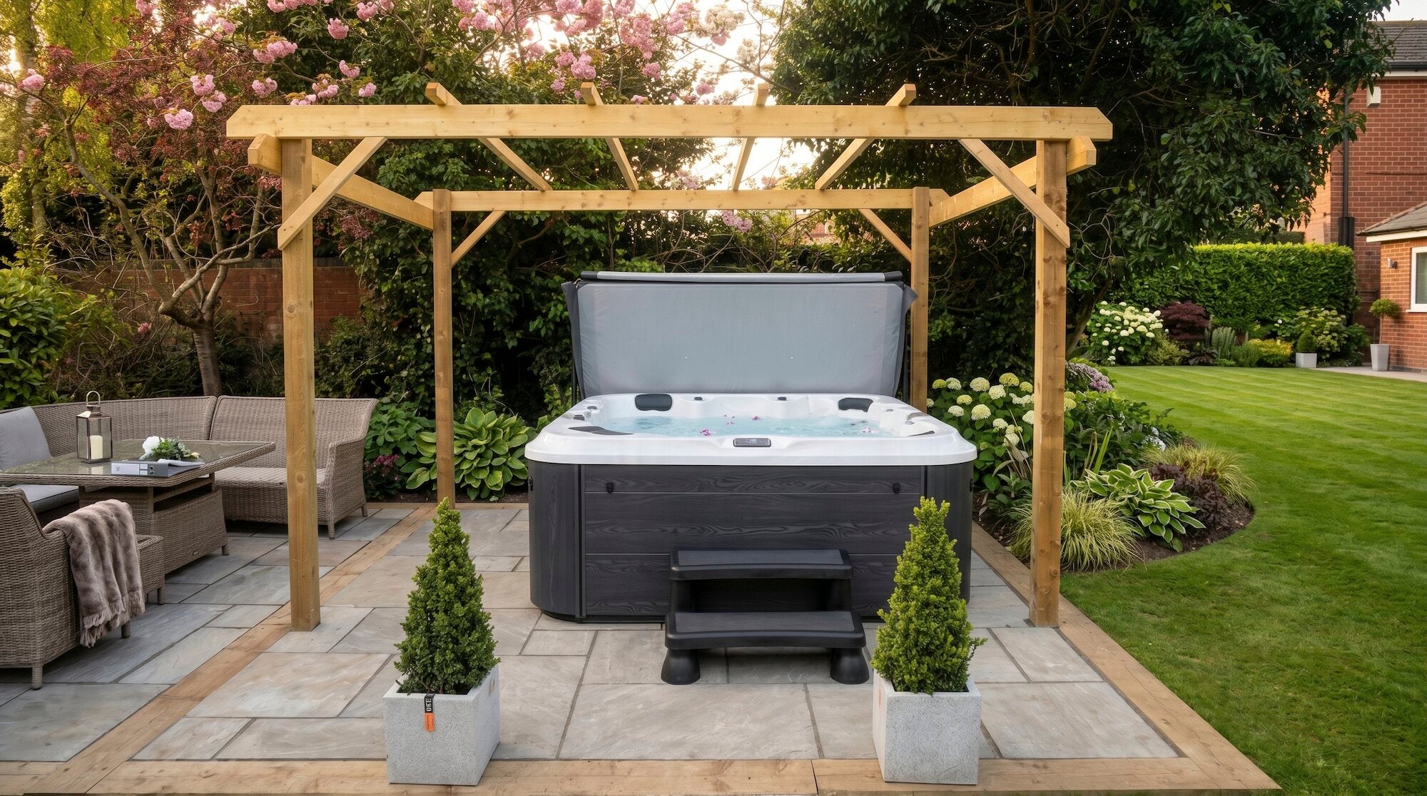 6000 Series hot tub on a patio in a garden