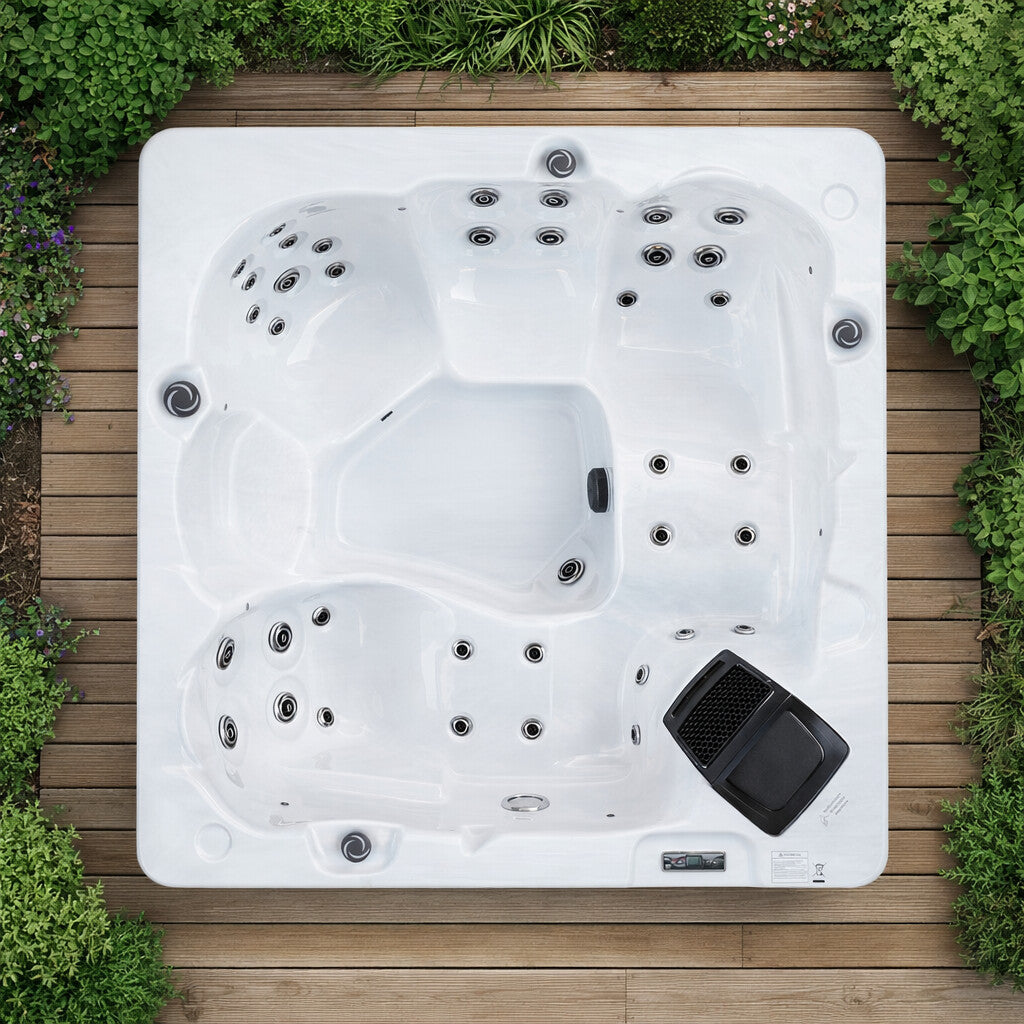 Hot tub on a wooden deck surrounded by greenery