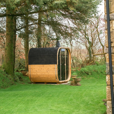 Cube 250 outdoor sauna in a garden