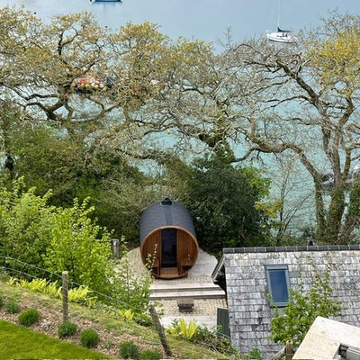 Barrel 210 outdoor sauna in a garden
