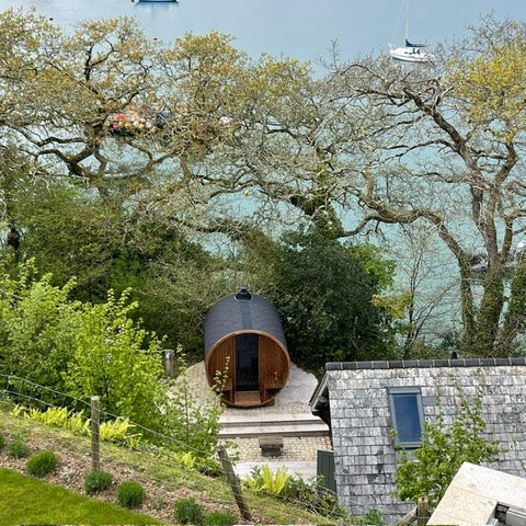 Barrel 210 outdoor sauna in a garden