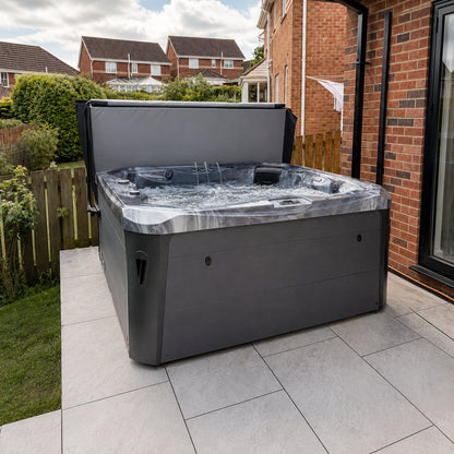 Hot tub on a patio area with a residential background