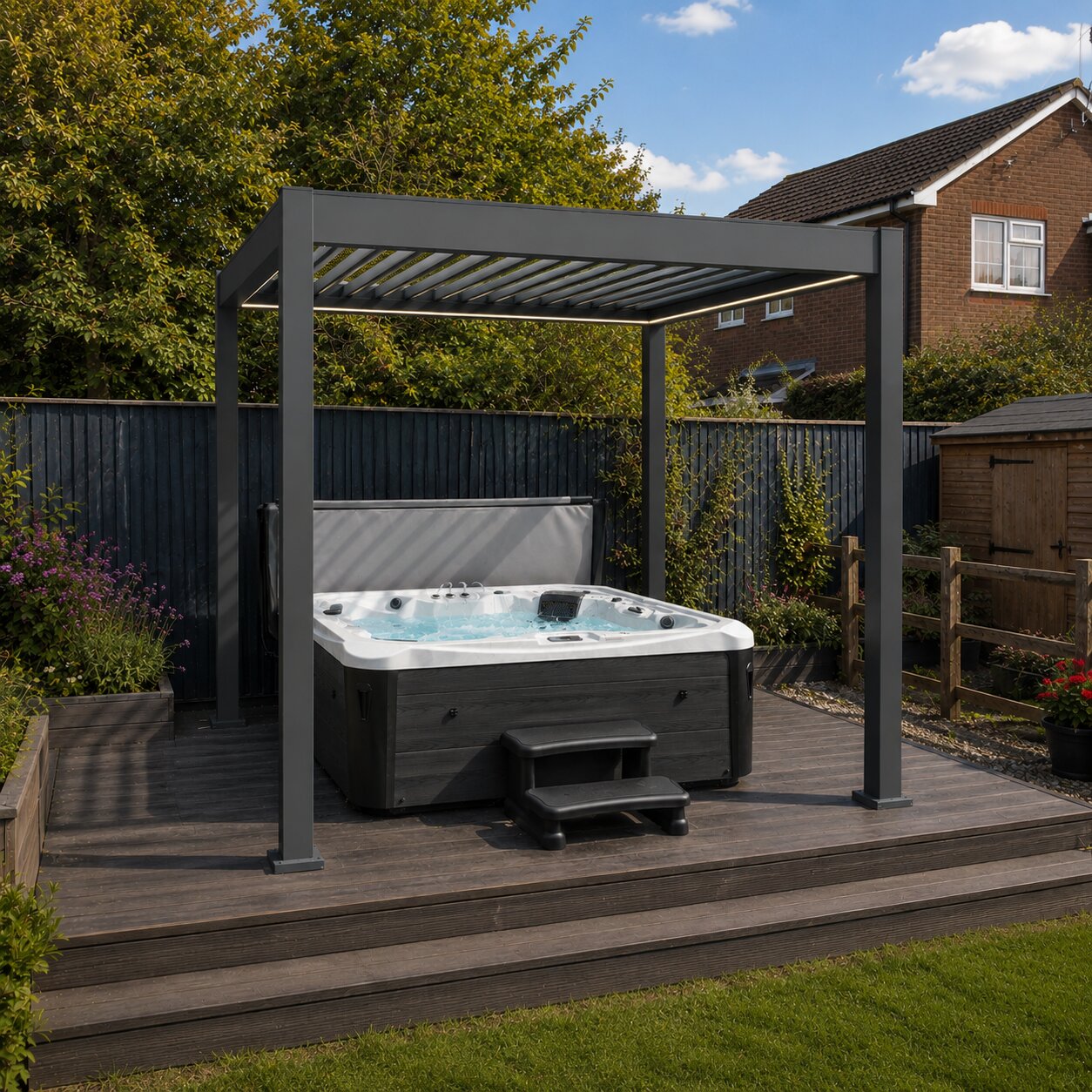 Aluminium pergola with a hot tub underneath on decking in a garden