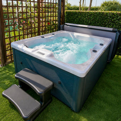 Hot tub with water in a garden setting