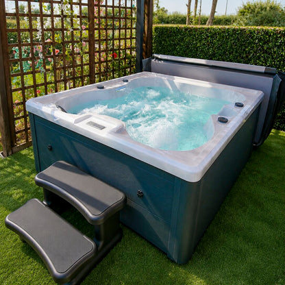 Hot tub with water in a garden setting