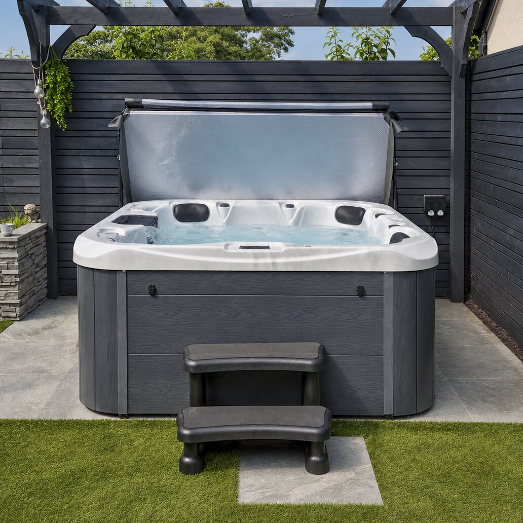 Hot tub with steps in a backyard setting