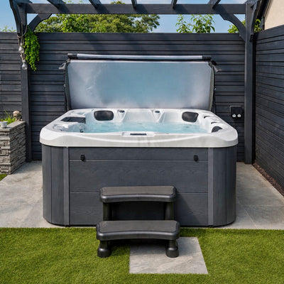Hot tub with steps in a backyard setting