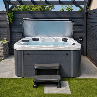 Hot tub with steps in a backyard setting