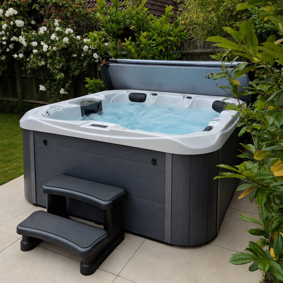 Hot tub in a garden setting with plants and flowers around