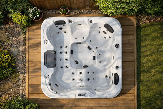 white hot tub on decking from above