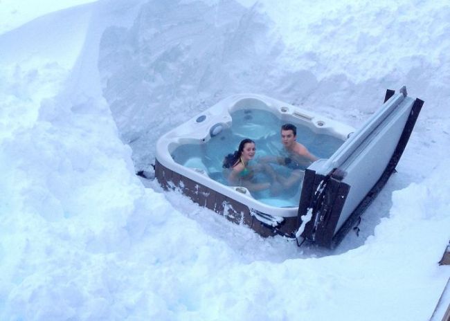 people in hot tub in winter